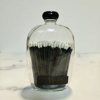 MATCHES IN GLASS DECANTER